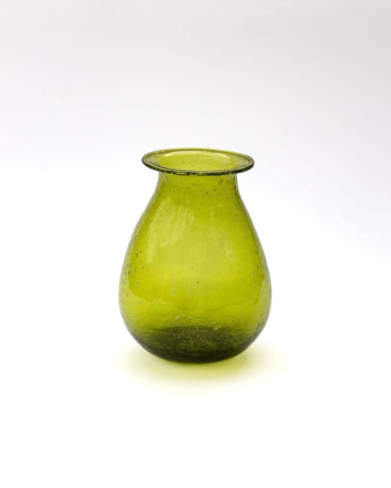 Green glass vase on a white background
