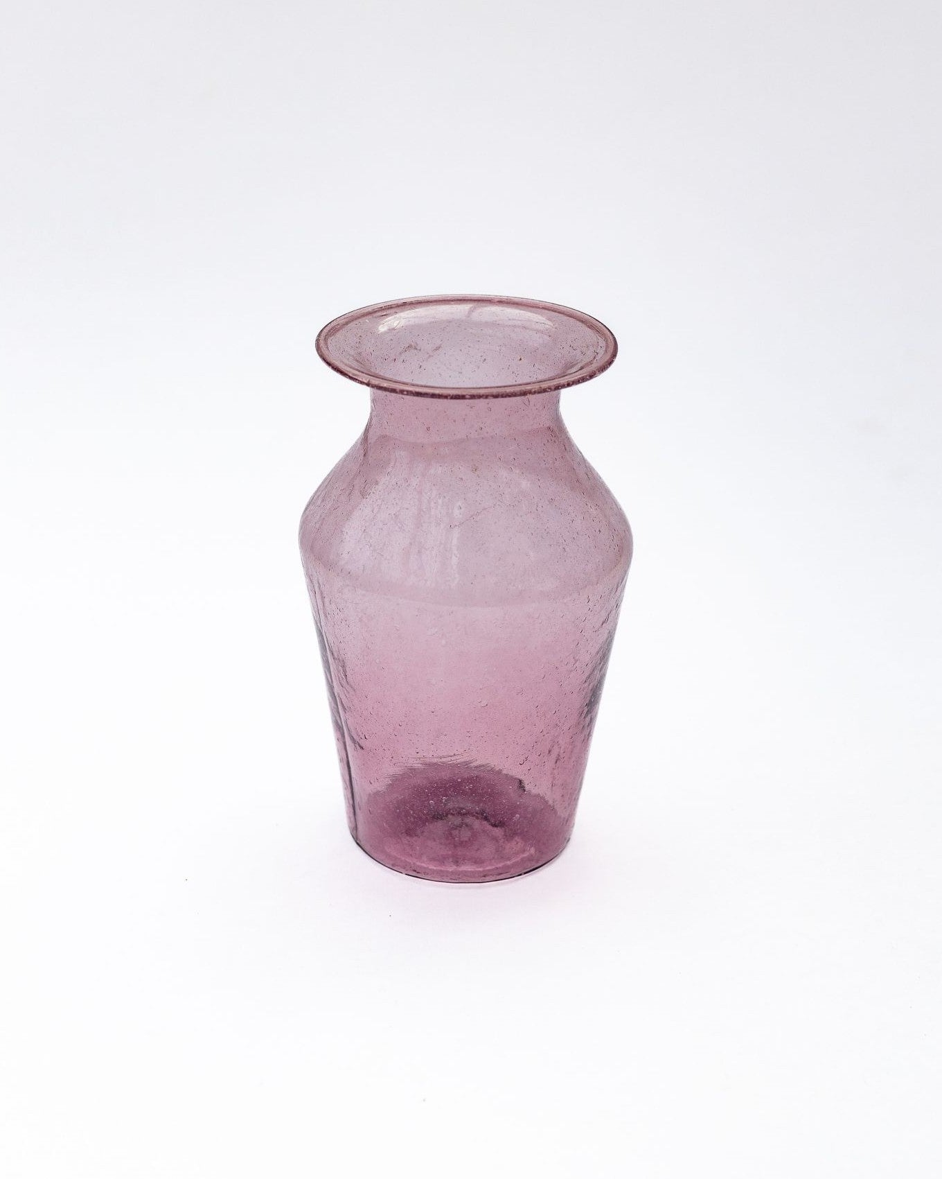 Pink glass vase on a white background