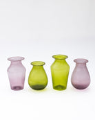 Four colorful glass vases on a white background