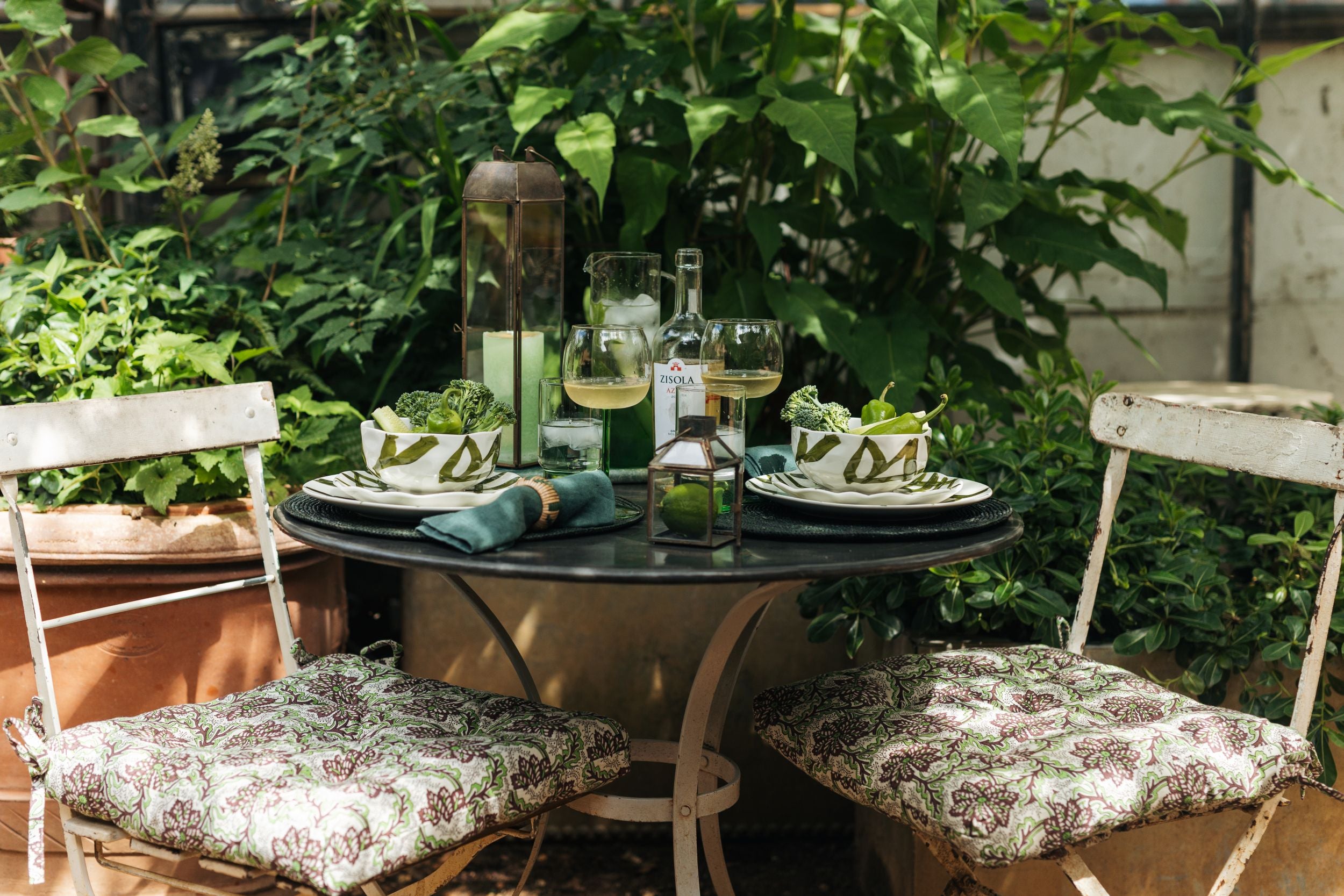 Outdoor setting with a table and chairs in a garden