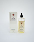 A bottle of Jean d'Aigle Eau de Cologne Elixir next to its white packaging box, set against a plain light gray background.