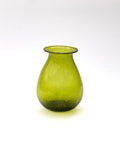 Green glass vase on a white background