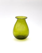 Green glass vase on a white background
