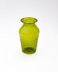 Green glass vase on a white background