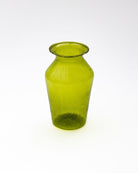 Green glass vase on a white background