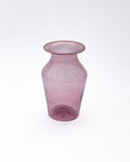 Pink glass vase on a white background