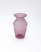 Pink glass vase on a white background